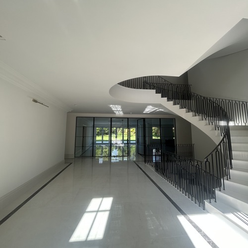 Large room and stairs with cornice