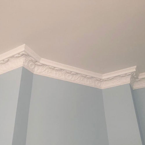 Classic cornice on blue wall